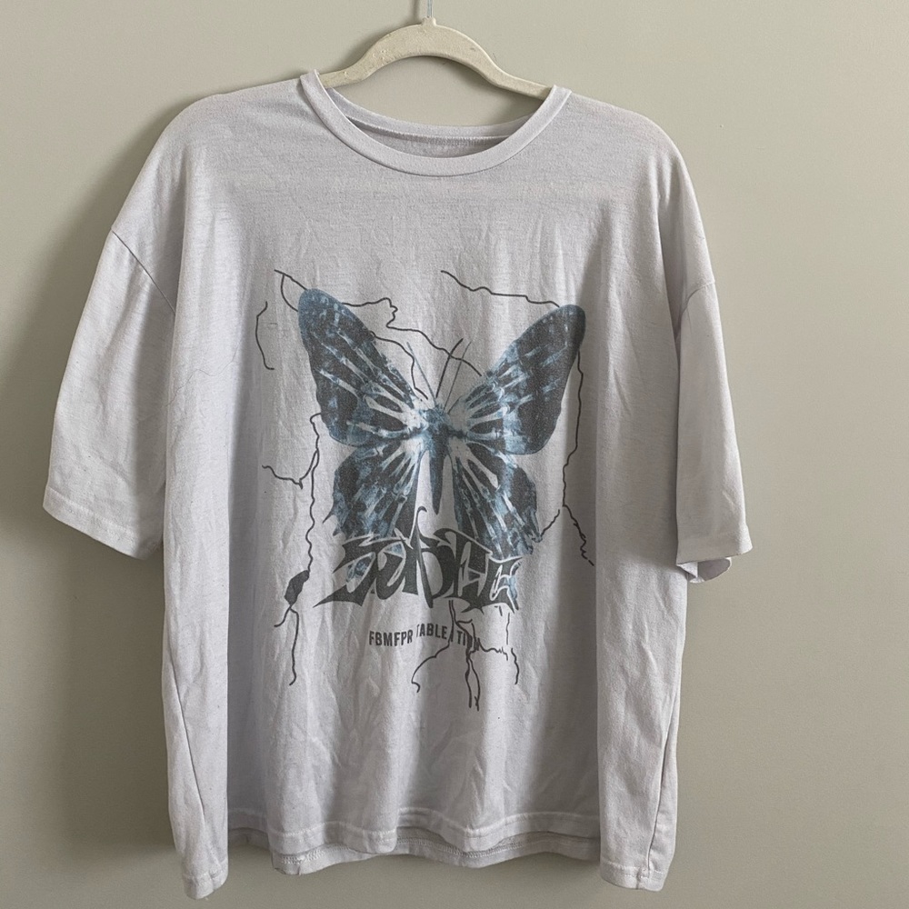 White t-shirt with blue butterfly